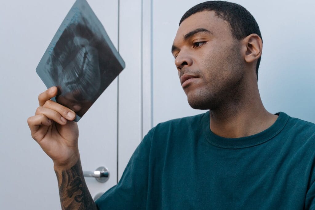 Man Looking at Xray Image of His Teeth